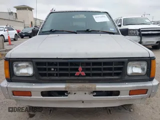 1990 Mitsubishi Mighty Max with VIN JA7FL24W6LP031144, listed as a IAAI auction lot 42152666 with 212,104 mi miles and . Bid and sale history available at DreamBid. Image 6.