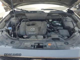 2018 Mazda CX-5 Grand Touring with VIN JM3KFADM3J1389911, listed as a Copart auction lot 60530295 with 103,177 mi miles and Salvage title. Bid and sale history available at DreamBid. Image 12.
