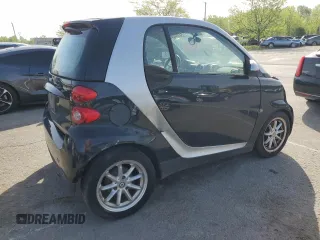 2009 Smart fortwo Pure z VIN WMEEJ31X39K211342, wystawiony jako Copart lot #54104045 z przebiegiem 46 162 mil mil oraz Tytuł czysty. Historia ofert i sprzedaży dostępna na DreamBid. Obrazek 3.