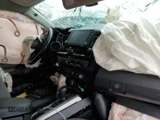 2020 Toyota Tacoma SR5 z VIN 3TMCZ5AN2LM339564, wystawiony jako Copart lot #57871255 z przebiegiem Nie podano mil oraz Szkoda całkowita • Salvage title. Historia ofert i sprzedaży dostępna na DreamBid. Obrazek 8.