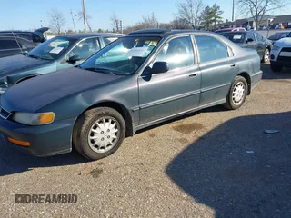 1996 Honda Accord EX w/Leather with VIN 1HGCD566XTA251134, listed as a IAAI auction lot 41461247 with 230,793 mi miles. Bid and sale history available at carsss.com. Image 2.