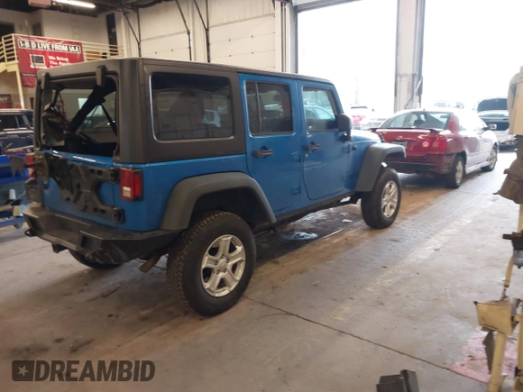 2015 Jeep Wrangler Unlimited Rubicon with VIN 1C4BJWFG7FL661643, listed as a IAAI auction lot 41291385 with 112,785 mi miles. Bid and sale history available at carsss.com. Image 4.