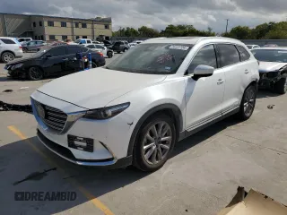 2021 Mazda CX-9 Grand Touring z VIN JM3TCADY2M0519977, wystawiony jako Copart lot #76137724 z przebiegiem 31 306 mil mil oraz Szkoda całkowita • Salvage title. Historia ofert i sprzedaży dostępna na DreamBid. Obrazek 1.
