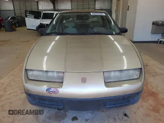1995 Saturn SL with VIN 1G8ZH5280SZ302560, listed as a Copart auction lot 63290495 with 123,475 mi miles and Clean title. Bid and sale history available at DreamBid. Image 5.