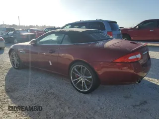 2013 Jaguar XK with VIN SAJWA4GB9DLB51059, listed as a Copart auction lot 77322014 with 0 mi miles and Salvage Title. Bid and sale history available at carsss.com. Image 2.