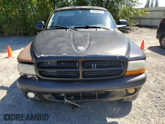 2001 Dodge Dakota Sport z VIN 1B7GG2AN81S113605, wystawiony jako Copart lot #58990065 z przebiegiem 243 919 mil mil oraz Czysty tytuł • Clean title. Historia ofert i sprzedaży dostępna na DreamBid. Obrazek 5.