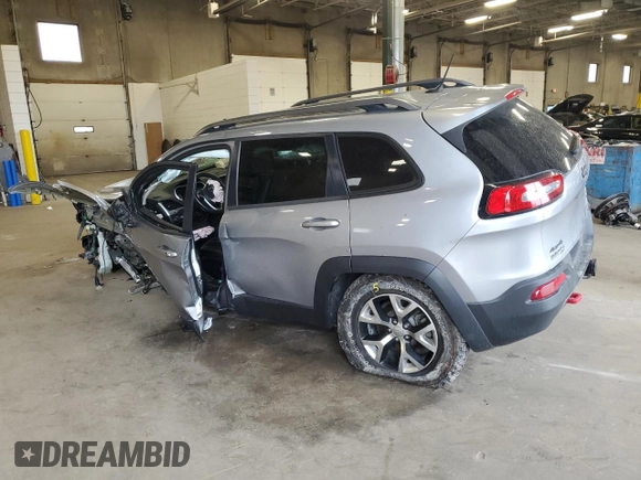 2014 Jeep Cherokee Trailhawk with VIN 1C4PJMBSXEW213981, listed as a Copart auction lot 60440495 with 136,612 mi miles and Salvage title. Bid and sale history available at DreamBid. Image 2.