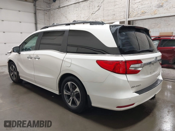 2019 Honda Odyssey Touring with VIN 5FNRL6H8XKB079113, listed as a IAAI auction lot 42359455 with 74,545 mi miles and . Bid and sale history available at DreamBid. Image 3.