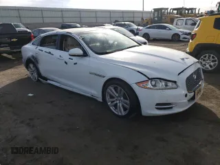 2014 Jaguar XJ with VIN SAJWA2GZ7E8V69543, listed as a Copart auction lot 86390204 with 110,929 mi miles and Salvage Title. Bid and sale history available at carsss.com. Image 4.
