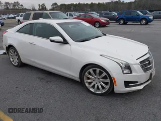 2015 Cadillac ATS Standard AWD z VIN 1G6AG1RX0F0127073, wystawiony jako IAAI lot #41296448 z przebiegiem 119 718 mil mil oraz . Historia ofert i sprzedaży dostępna na DreamBid. Obrazek 1.