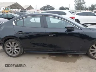 2021 Mazda 3 Premium with VIN JM1BPADL4M1329041, listed as a IAAI auction lot 42291604 with 93,248 mi miles and . Bid and sale history available at DreamBid. Image 14.