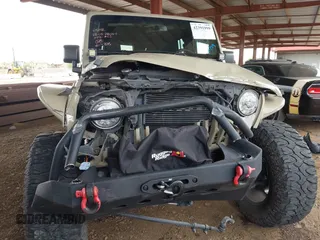 2017 Jeep Wrangler Unlimited Rubicon with VIN 1C4BJWFG7HL663203, listed as a IAAI auction lot 42391999 with 63,430 mi miles and . Bid and sale history available at DreamBid. Image 6.