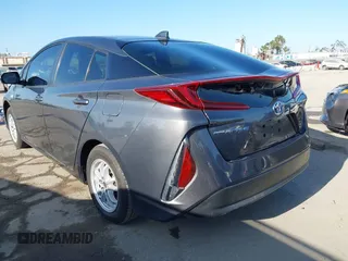 2021 Toyota Prius LE with VIN JTDKAMFP1M3195662, listed as a IAAI auction lot 42799476 with 47,560 mi miles and . Bid and sale history available at DreamBid. Image 3.