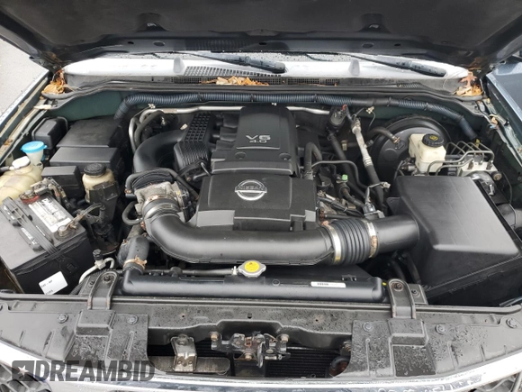 2005 Nissan Pathfinder SE z VIN 5N1AR18W65C705332, wystawiony jako Copart lot #86779704 z przebiegiem 119 877 mil mil oraz Czysty tytuł • Clean title. Historia ofert i sprzedaży dostępna na DreamBid. Obrazek 12.