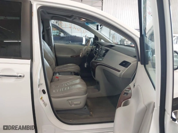2012 Toyota Sienna XLE AAS with VIN 5TDYK3DC2CS196897, listed as a IAAI auction lot 41762345 with 183,188 mi miles. Bid and sale history available at carsss.com. Image 5.