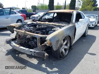 2013 Dodge Challenger SXT z VIN 2C3CDYAGXDH524225, wystawiony jako IAAI lot #41913504 z przebiegiem Nie podano mil oraz . Historia ofert i sprzedaży dostępna na DreamBid. Obrazek 2.