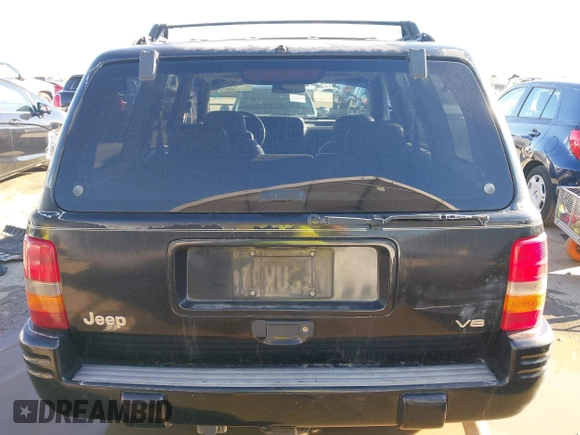 1998 Jeep Grand Cherokee Limited z VIN 1J4GZ78Y3WC105625, wystawiony jako IAAI lot #41742805 z przebiegiem 222 045 mil mil oraz . Historia ofert i sprzedaży dostępna na DreamBid. Obrazek 16.