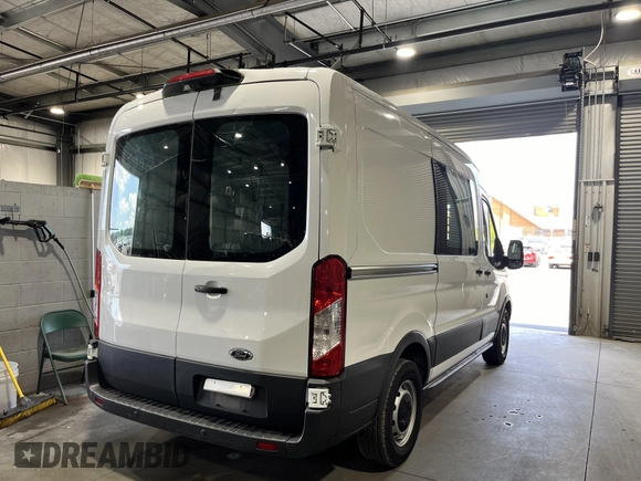 2018 Ford Transit with VIN 1FTYE1CM6JKB31142, listed as a IAAI auction lot 42785382 with 79,664 mi miles and . Bid and sale history available at DreamBid. Image 16.