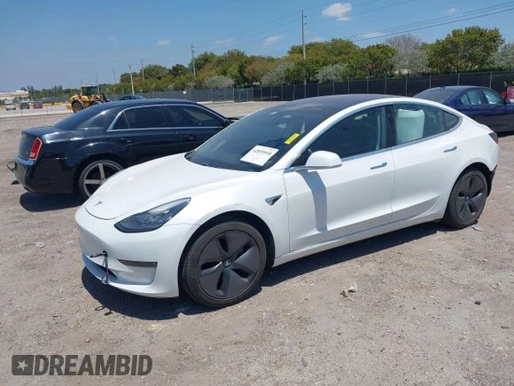 2018 Tesla Model 3 Long Range Battery with VIN 5YJ3E1EAXJF027179, listed as a IAAI auction lot 42059918 with 43,566 mi miles. Bid and sale history available at carsss.com. Image 18.