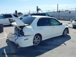 2005 Mitsubishi Lancer Evolution VIII with VIN JA3AH86DX5U054278, listed as a IAAI auction lot 41881180 with 157,497 mi miles. Bid and sale history available at carsss.com. Image 4.