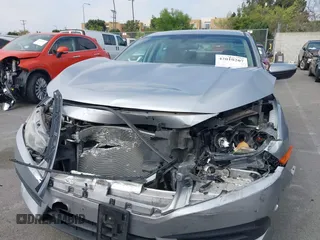 2017 Honda Civic LX with VIN 2HGFC2F5XHH562089, listed as a IAAI auction lot 42010207 with 99,809 mi miles and . Bid and sale history available at DreamBid. Image 12.