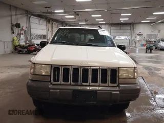 1997 Jeep Grand Cherokee Laredo z VIN 1J4GZ58S9VC562907, wystawiony jako IAAI lot #42102313 z przebiegiem 137 672 mil mil oraz . Historia ofert i sprzedaży dostępna na DreamBid. Obrazek 12.