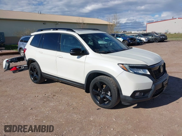 2019 Honda Passport Elite z VIN 5FNYF8H0XKB001472, wystawiony jako IAAI lot #42143890 z przebiegiem 98 119 mil mil oraz . Historia ofert i sprzedaży dostępna na DreamBid. Obrazek 1.