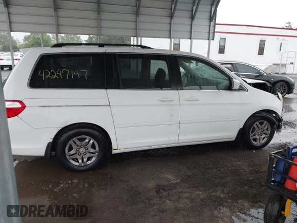 2007 Honda Odyssey EX-L z VIN 5FNRL38717B400727, wystawiony jako IAAI lot #42247147 z przebiegiem 199 430 mil mil oraz . Historia ofert i sprzedaży dostępna na DreamBid. Obrazek 13.