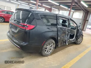 2023 Chrysler Pacifica Touring L with VIN 2C4RC1BG3PR582271, listed as a Copart auction lot 51644595 with 57,930 mi miles and Salvage title. Bid and sale history available at DreamBid. Image 3.