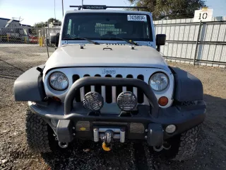 2009 Jeep Wrangler Rubicon with VIN 1J4GA64149L757121, listed as a Copart auction lot 74258934 with 73,241 mi miles and Salvage Title. Bid and sale history available at DreamBid. Image 5.