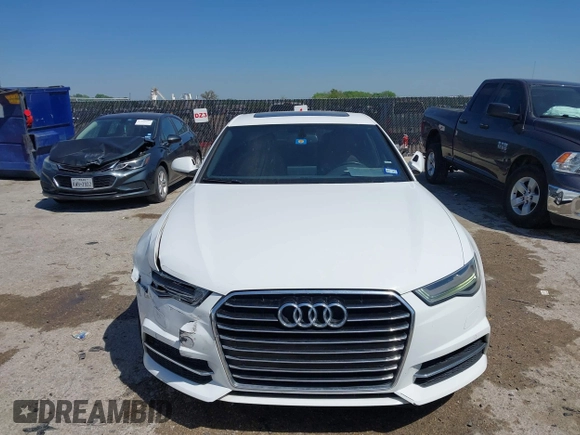 2016 Audi A6 2.0T Premium Plus with VIN WAUGFAFC4GN045229, listed as a IAAI auction lot 41974532 with 122,585 mi miles. Bid and sale history available at carsss.com. Image 12.