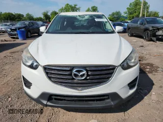 2016 Mazda CX-5 Sport with VIN JM3KE4BYXG0704194, listed as a Copart auction lot 62095735 with 93,970 mi miles and Salvage title. Bid and sale history available at DreamBid. Image 5.