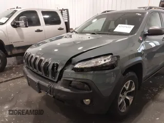 2015 Jeep Cherokee Trailhawk with VIN 1C4PJMBB4FW528633, listed as a IAAI auction lot 42147632 with 166,669 mi miles and . Bid and sale history available at DreamBid. Image 6.