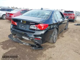 2019 BMW 5 Series 530e iPerformance with VIN WBAJA9C59KB389304, listed as a IAAI auction lot 41562928 with 64,137 mi miles. Bid and sale history available at carsss.com. Image 4.