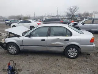 1999 Honda Civic LX with VIN 2HGEJ6675XH504044, listed as a IAAI auction lot 41949437 with 208,534 mi miles. Bid and sale history available at carsss.com. Image 13.