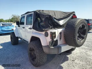2012 Jeep Wrangler Unlimited Sahara with VIN 1C4BJWEG6CL256452, listed as a Copart auction lot 53305115 with 50,944 mi miles and Salvage Title. Bid and sale history available at carsss.com. Image 2.