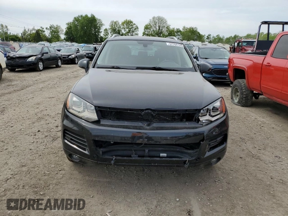 2012 Volkswagen Touareg Sport with VIN WVGFF9BP8CD001039, listed as a Copart auction lot 57764125 with 128,540 mi miles and Clean title. Bid and sale history available at DreamBid. Image 5.