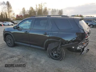2023 Honda Pilot TrailSport with VIN 5FNYG1H63PB017335, listed as a Copart auction lot 75012154 with 5,870 mi miles and Salvage Title. Bid and sale history available at carsss.com. Image 2.