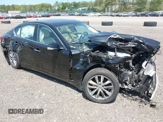 2015 Infiniti Q50 Premium z VIN JN1BV7AR4FM410949, wystawiony jako IAAI lot #42243917 z przebiegiem 56 552 mil mil oraz . Historia ofert i sprzedaży dostępna na DreamBid. Obrazek 1.