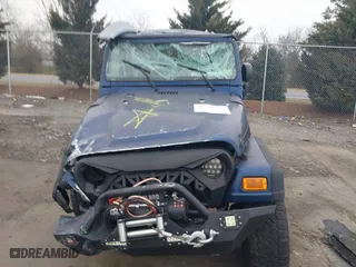 2003 Jeep Wrangler X with VIN 1J4FA39S23P300447, listed as a IAAI auction lot 41791733 with 165,576 mi miles. Bid and sale history available at carsss.com. Image 12.
