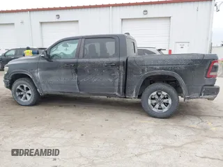 2019 Ram 1500 Rebel z VIN 1C6SRFLT6KN599362, wystawiony jako IAAI lot #41560018 z przebiegiem Nie podano mil oraz . Historia ofert i sprzedaży dostępna na DreamBid. Obrazek 14.