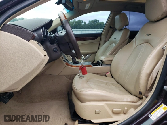 2009 Cadillac CTS RWD with VIN 1G6DV57V490111006, listed as a Copart auction lot 66313174 with 148,467 mi miles and Salvage Title. Bid and sale history available at DreamBid. Image 7.