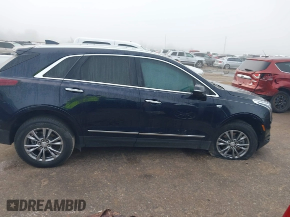 2021 Cadillac XT5 FWD Premium Luxury with VIN 1GYKNCRS2MZ185678, listed as a IAAI auction lot 41143084 with 25,399 mi miles and . Bid and sale history available at carsss.com. Image 13.