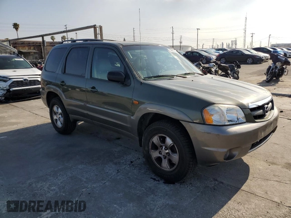 2002 Mazda Tribute LX with VIN 4F2YU08112KM16716, listed as a Copart auction lot 55095645 with 113,885 mi miles and Salvage Title. Bid and sale history available at DreamBid. Image 4.