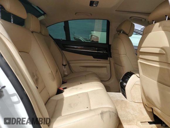 2013 BMW 7 Series 740i with VIN WBAYA6C58DC995137, listed as a Copart auction lot 75774104 with 61,847 mi miles and Salvage Title. Bid and sale history available at carsss.com. Image 10.