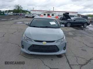 2014 Scion tC z VIN JTKJF5C71E3081033, wystawiony jako IAAI lot #42333111 z przebiegiem 144 124 mil mil oraz . Historia ofert i sprzedaży dostępna na DreamBid. Obrazek 6.