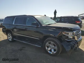 2017 Chevrolet Suburban LT with VIN 1GNSCHKC3HR331854, listed as a Copart auction lot 50998945 with 138,158 mi miles and Salvage Title. Bid and sale history available at carsss.com. Image 4.