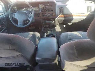 1997 Jeep Grand Cherokee Laredo with VIN 1J4GZ58S1VC760400, listed as a Copart auction lot 43932815 with 108,112 mi miles and Salvage Title. Bid and sale history available at carsss.com. Image 8.