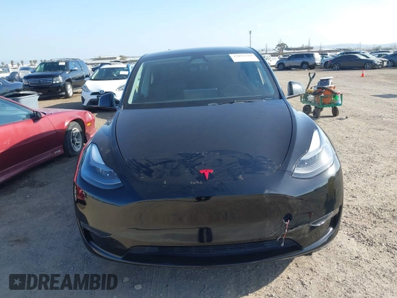 2023 Tesla Model Y Performance with VIN 7SAYGDEF4PF809308, listed as a IAAI auction lot 42056769 with 12,101 mi miles and . Bid and sale history available at DreamBid. Image 11.