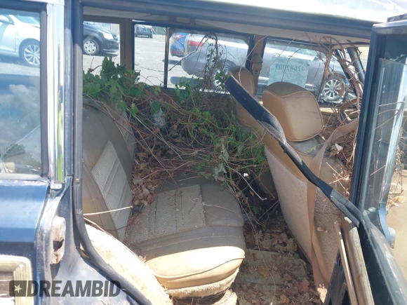 1988 Jeep Grand Wagoneer with VIN 1JCNJ15U7JT237152, listed as a IAAI auction lot 42682009 with 159,950 mi miles and . Bid and sale history available at DreamBid. Image 8.
